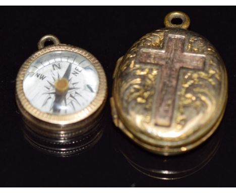 Victorian locket with cross decoration and a yellow metal compass charm&nbsp;