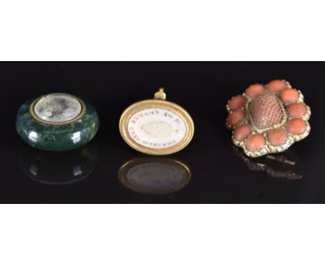 A moss agate compass charm, carved coral Victorian brooch and a yellow metal intaglio seal set with green and white enamel an