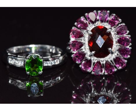 Two 9ct white gold rings, one set with garnet and amethyst the other diopside, size N and M, 8.5g