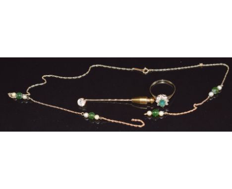 A 9ct gold stick pin, 9ct gold ring set with an emerald and cubic zirconia, and 9ct gold necklace set with jade and pearls, 4