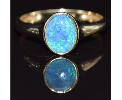 A 9ct gold ring set with an opal triplet, size N, 1.7g