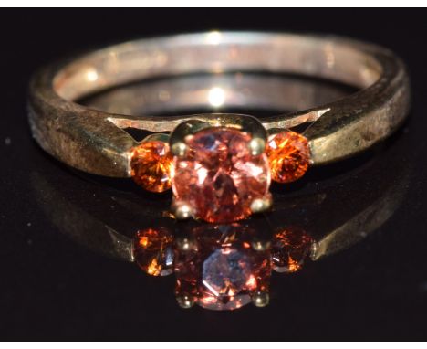 A 9k gold ring set with andesine and garnet, size N, 2.6g