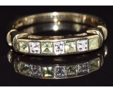A 9ct gold half eternity ring set with peridot and diamonds, size N, 2.7g