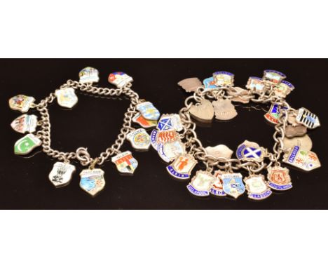 Two silver charm bracelets with enamel shield charms, 64g