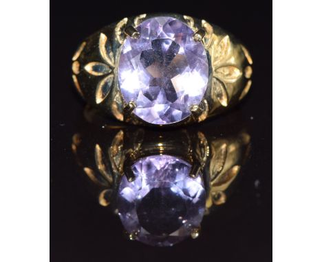 A 9ct gold ring set with an oval cut amethyst, size M, 5.1g