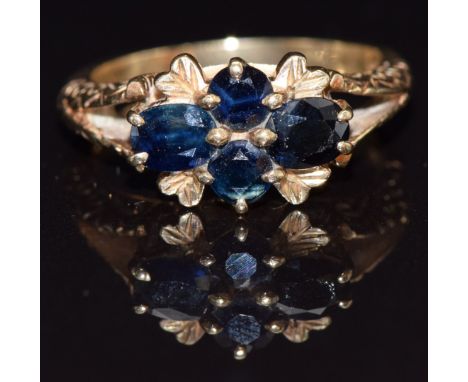 A 9ct gold ring set with four oval sapphires, size N, 4.5g