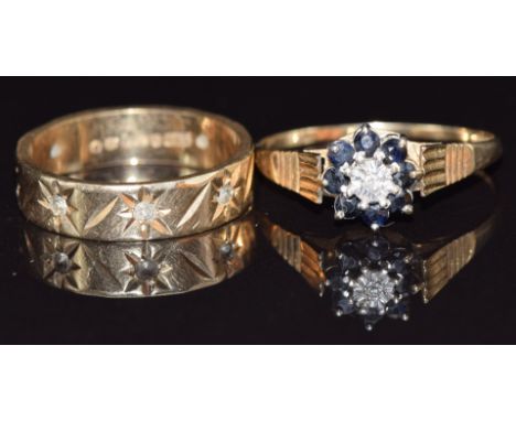 A 9ct gold eternity ring and a 9ct gold ring set with a diamond and sapphires, size N, 4.6g