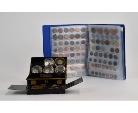 An amateur collection of overseas coinage contained in both an album and a vintage cashbox