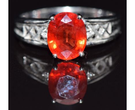 An 18ct gold ring set with an oval cut sapphire, size N, 4.2g