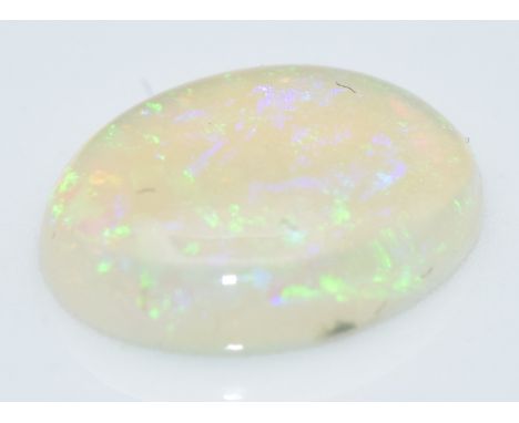 A loose oval cut opal measuring&nbsp;approximately 0.93cts&nbsp;