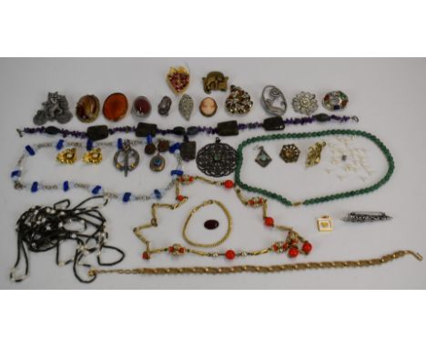 A collection of costume jewellery including beads, amethyst necklace, Victorian locket, Miracle brooch, other brooches, neckl
