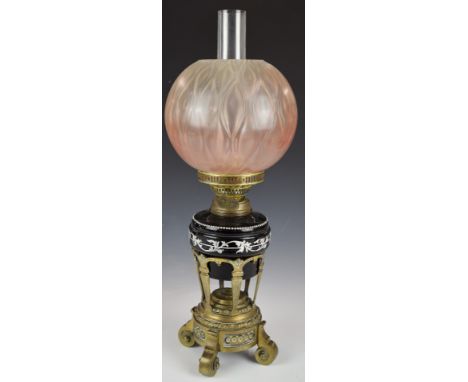 19thC oil lamp with ornate brass stand and glass shade, H59cm