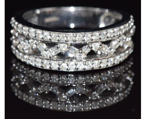 A 9ct white gold ring set with round and baguette cut diamonds, size M/N, 5.3g