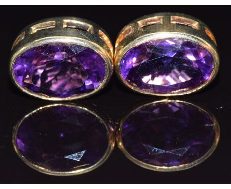 A pair of 9ct gold earrings set with an oval cut amethyst to each, 7.6g&nbsp;