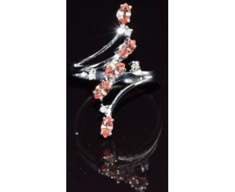 A 9k white gold ring set with Ceylon padparadscha sapphires, size M, 4.6g