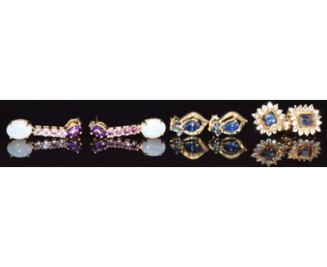 Three pairs of 9ct gold earrings, one set with sapphires, one mystic topaz and the other amethyst and opal, 7.5g&nbsp;