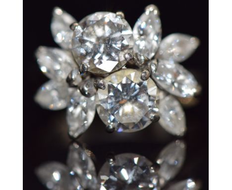 An 18ct white gold ring set with two round cut diamonds of approximately 0.6ct&nbsp;and further marquise cut diamonds, in vin