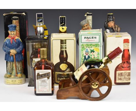 A large collection of alcohol including novelty figural Garnier Gin, Vodka and Whisky, Courvoisier on a gun wagon, multiple l