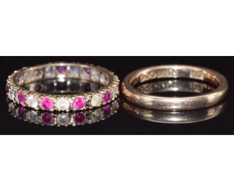 A 9ct gold band and a 9ct gold eternity ring set with paste, size K, 4.1g