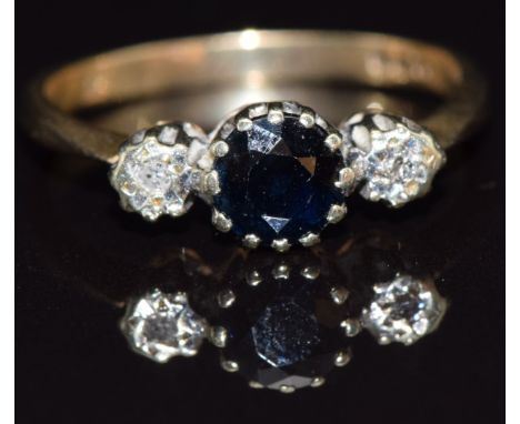 A 9ct gold ring set with a sapphire and diamonds, size N, 2.2g