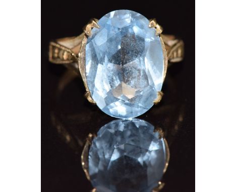 A 9ct gold ring set with an oval cut topaz, size J, 3.8g