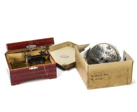 A manivelle disc musical box, Edelweiss, in rectangular wood case with colour print of chuildren on the lid, in maker's cardb