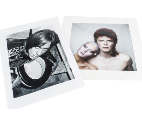 Iggy Pop / David Bowie,  a black and white image of a young Iggy Pop posing with a toilet taken by Mick Rock (53cm x 36cm) to
