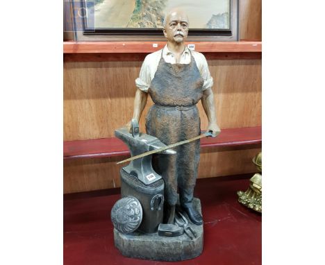 A very well made ceramic statue of the Iron Chancellor, forging the sword. It stands 33" inches in height, he is dressed as a