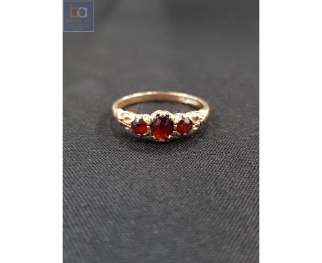 18 CARAT GOLD &amp; GARNET RING