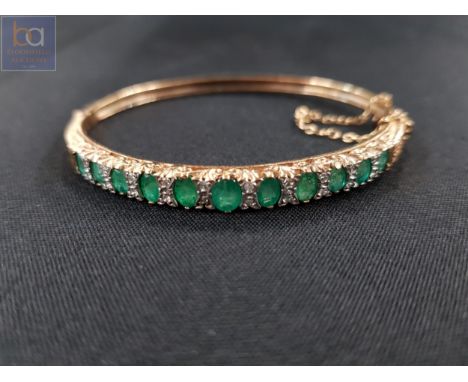 9 CARAT GOLD EMERALD &amp; DIAMOND BANGLE ACCOMPANIED WITH VALUATION AT £6,000 