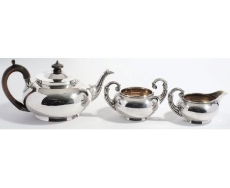 A George IV silver two-piece tea service, maker Robert Garrard, London, 1822: of plain circular form, together with a matched