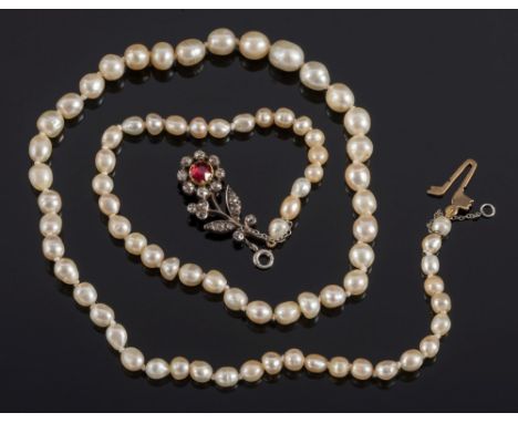A natural pearl, possibly, single-string necklace: with ruby and diamond flower clasp, approximately 44cm long, 14.5gms gross
