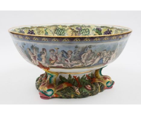 A Meyer & Elliott transfer printed punch bowl of generous proportions: of circular form supported by three dolphins, seaweed 