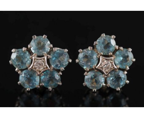 A pair of aquamarine and diamond circular cluster ear-studs: each with a central small diamond within a surround of circular 