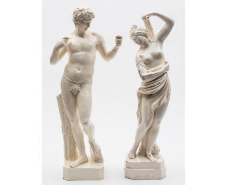 A pair of large Nove creamware figures: , he modelled standing before a stump wearing a fig leaf, on a canted square base, sh
