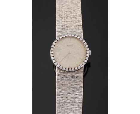 Piaget. A lady's 1960's 18ct white gold and diamond set wristwatch:, the dial with baton markers and thirty six brilliant-cut