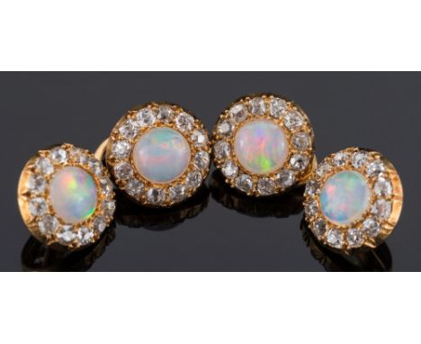 A pair of yellow gold, opal and diamond circular cuff-links:, each with a single opal approximately 7mm diameter, within a su