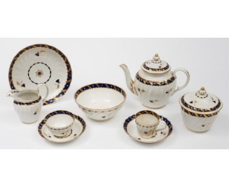 A Worcester, probably Flight period, tea service: of wrythen moulded form comprising a teapot and cover, sugar bowl and cover