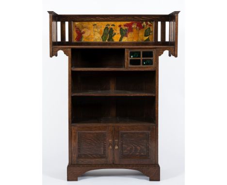 By Shapland and Petter, Barnstaple 
An Edwardian oak and decorated bookcase:, the overhanging railed top with a moulded and p