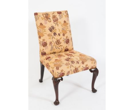 A George II carved mahogany side chair:, with upholstered stuff over back and seat in floral tapestry fabric, on cabriole leg