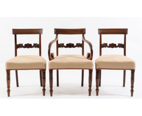 A set of eight late Regency mahogany dining chairs:, the backs with reeded curved bar top rails and horizontal splats carved 