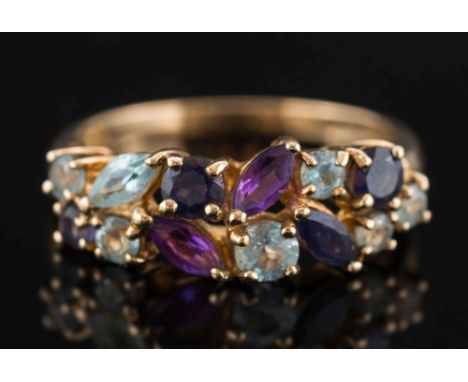 A modern 9ct gold and gem-set dress ring: mounted with marquise shaped amethysts and aquamarines, ring size P 1/2. 


