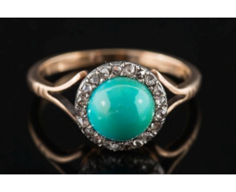 A turquoise and rose diamond circular cluster ring: the central, circular single turquoise within a surround of rose-cut diam