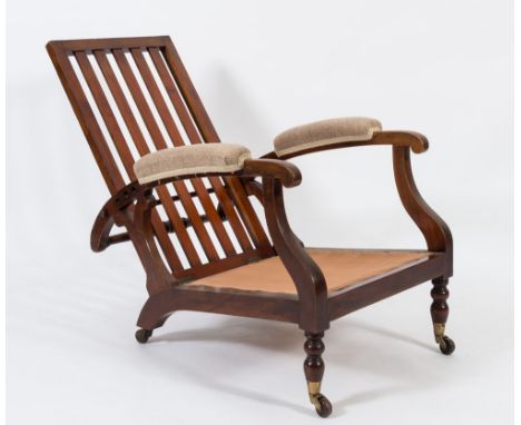 By James Shoolbread & Co - A 19th Century mahogany low adjustable armchair:, having a slatted back and padded arm supports an