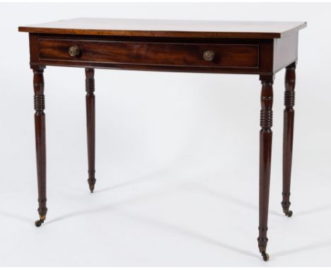 An early 19th Century mahogany and inlaid bow-fronted side table:, the top with a boxwood strung edge, fitted with a single l