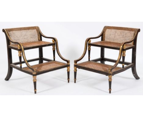 A pair of Regency ebonised and gilt decorated two tread bed steps:, with curved cane panel tops and inset twin treads, having