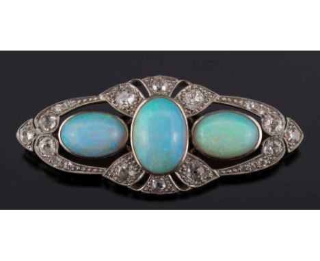 An early 20th century opal and diamond oblong brooch:, the three central oval opals within a surround of mille-grain set old-