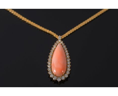 An 'angel' skin coral and diamond tear-drop pendant necklace: with single pear-shaped 'angel-skin' light pink coral approxima