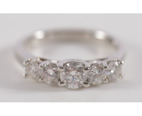 A platinum and diamond five-stone ring: with graduated circular brilliant-cut diamonds estimated to weigh a total of 1.0ct, r