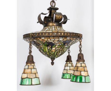 A Tiffany-style circular ceiling light:  with Iris pattern floral decoration, having four drop suspensions and shades, 50cm. 